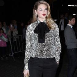 Kate Upton looks smart and stylish in her pussybow blouse