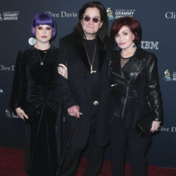 Kelly Osbourne with her parents Ozzy and Sharon Osbourne