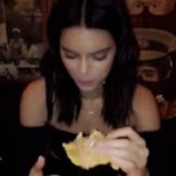 Kendall Jenner eating a burger via Bella Hadid's Snapchat