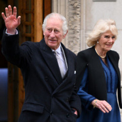 King Charles has been seen smiling amid his cancer battle as he returned from a brief meeting with Prince Harry