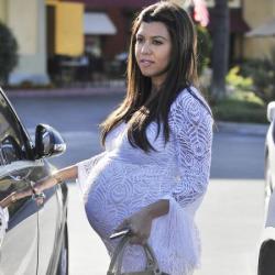 Kourtney wears one of her favoured maxi dresses whilst pregnant