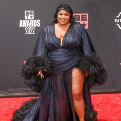 Lizzo wants to get in the middle of Kourtney Kardashian and Travis Barker’s trademark public displays of affection