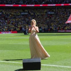 Natalie Coyle singing at Wembley in May