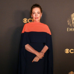 Olivia Colman thinks she could be a dog walker