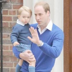 Britain's Prince George with the Duke of Cambridge