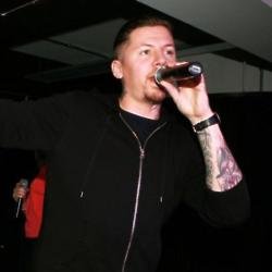 Professor Green performing at an event for Spotify and Uber.