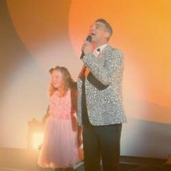 Robbie Williams performing for Mastercard