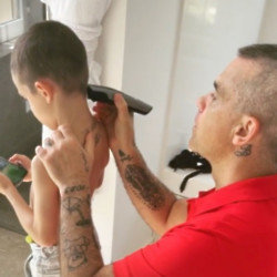 Robbie Williams shaves son Charlie's hair