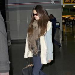Selena Gomez keeps warm in a thick scarf