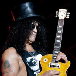 Slash's go-to guitar is the Les Paul after seeing Jimmy Page and Eric Clapton playing the guitar