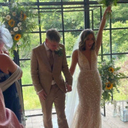 The bride and groom danced with loved ones and friends at their barn wedding