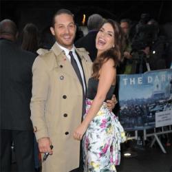 Tom Hardy wears a trench coat to the Dark Knight Rises premiere in London