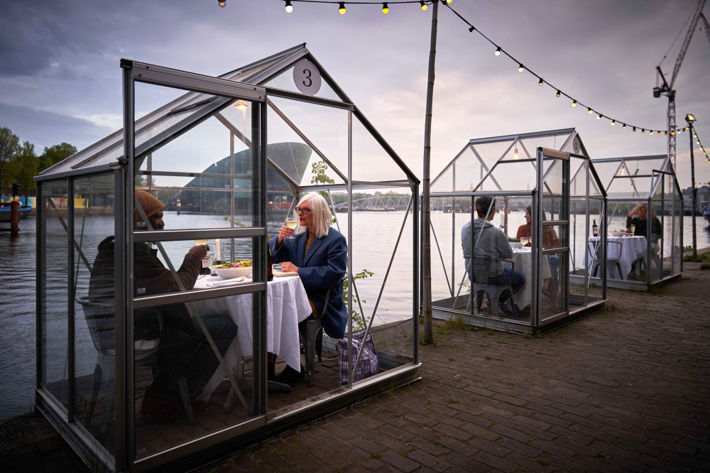 This Amsterdam restaurant is seating guests in mini greenhouses to help stop coronavirus