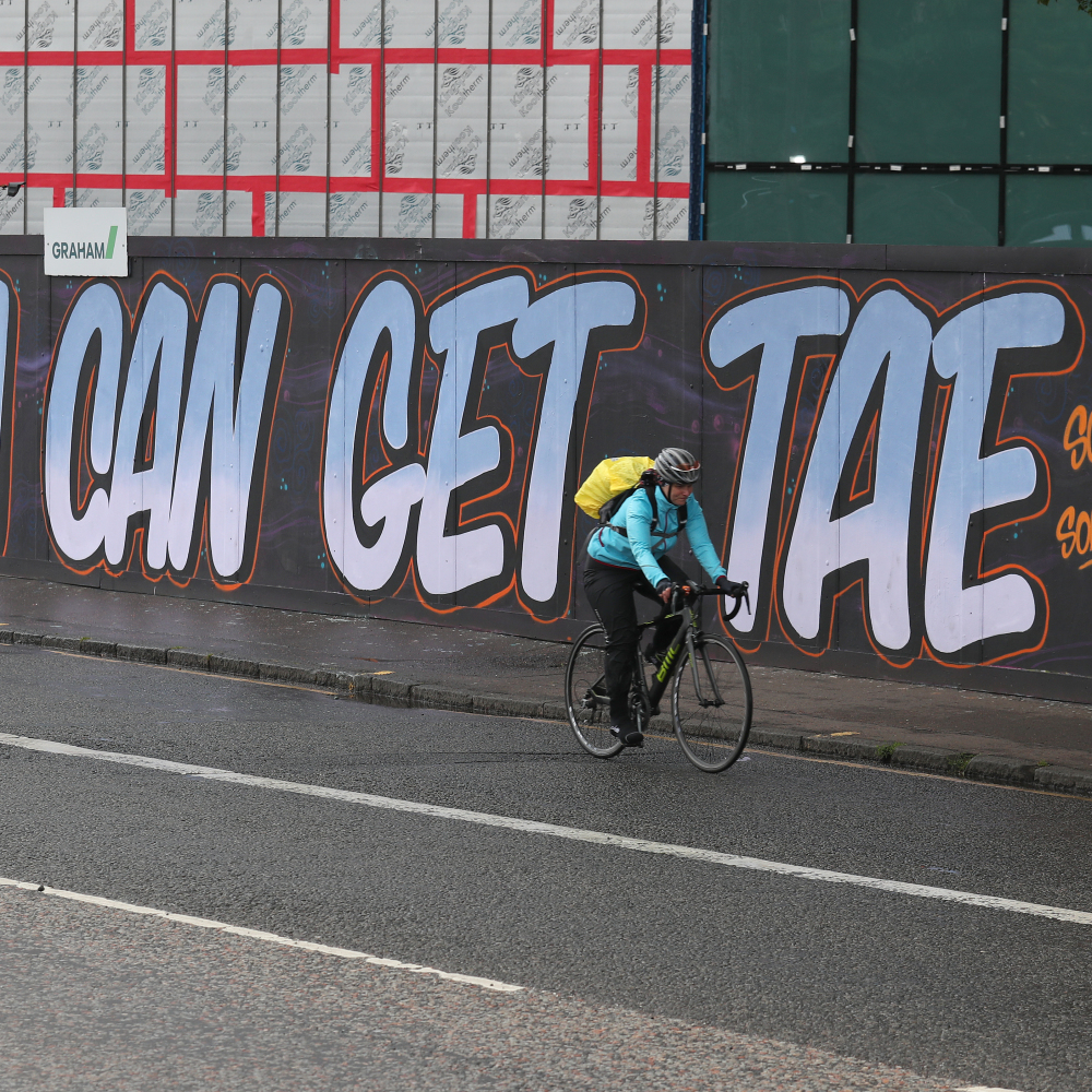 A cyclist passes graffiti in Edinburgh following a raft of Black Lives Matter protests took place across the UK