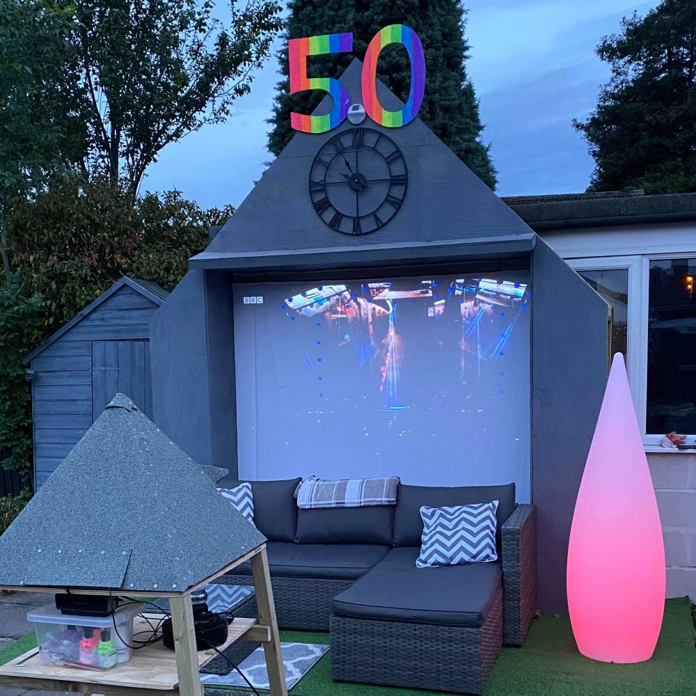 A projector, designed to look like the Pyramid Stage will stream highlights all weekend
