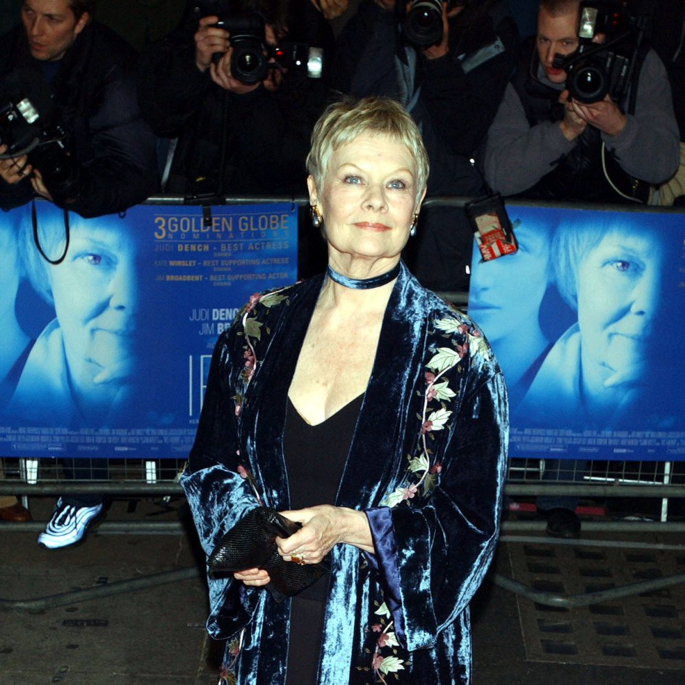 Dame Judi Dench arrives at the Curzon Mayfair in central London, for the premiere of 'Iris'. The film follows the story of Booker Prize-winning novelist and philosopher Iris Murdoch who died in 1999, played by Kate Winslet and Judi Dench. 2002
