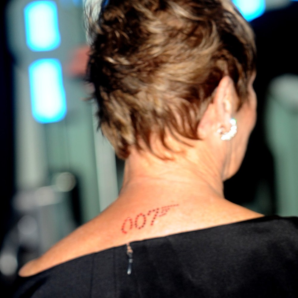 The 007, James Bond logo on the back of Dame Judi Dench's neck as she arrives for the World premiere of 'Quantum Of Solace' at the Odeon Leicester Square, WC2.