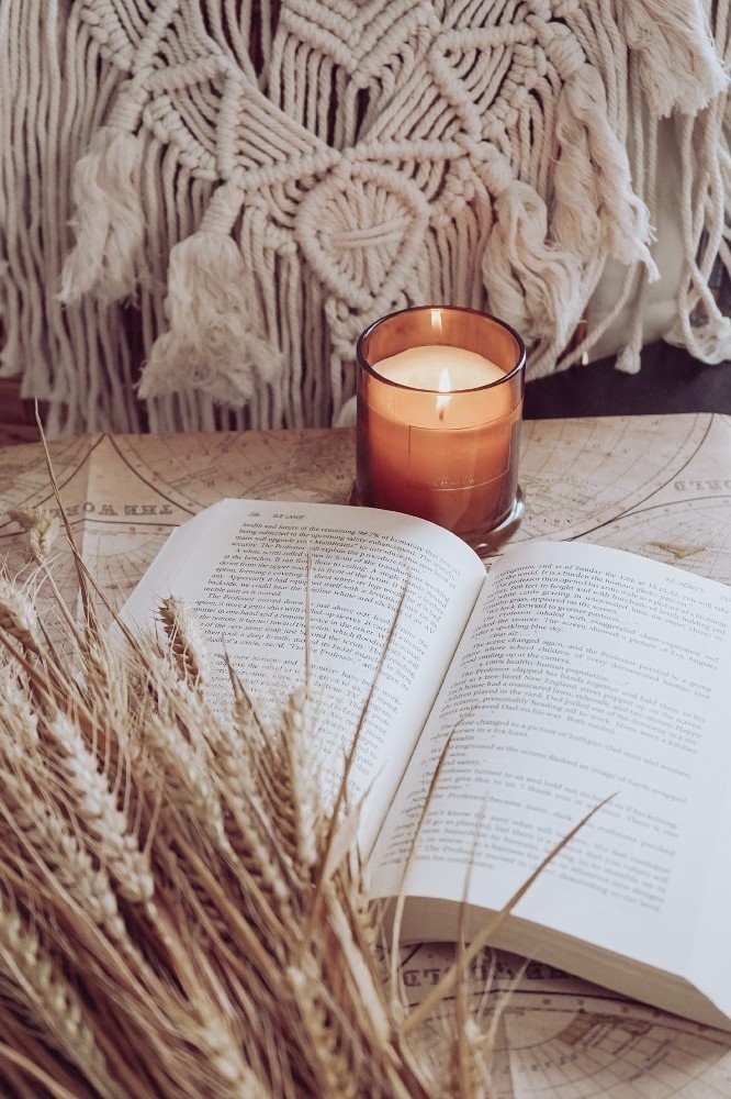 A good book and a candle can do wonders... / Picture Credit: Unsplash
