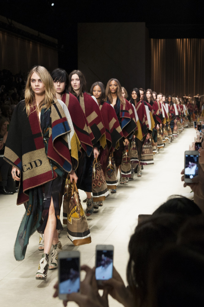 Cara Delevingne leads a storm of models at Burberry Prorsum AW14