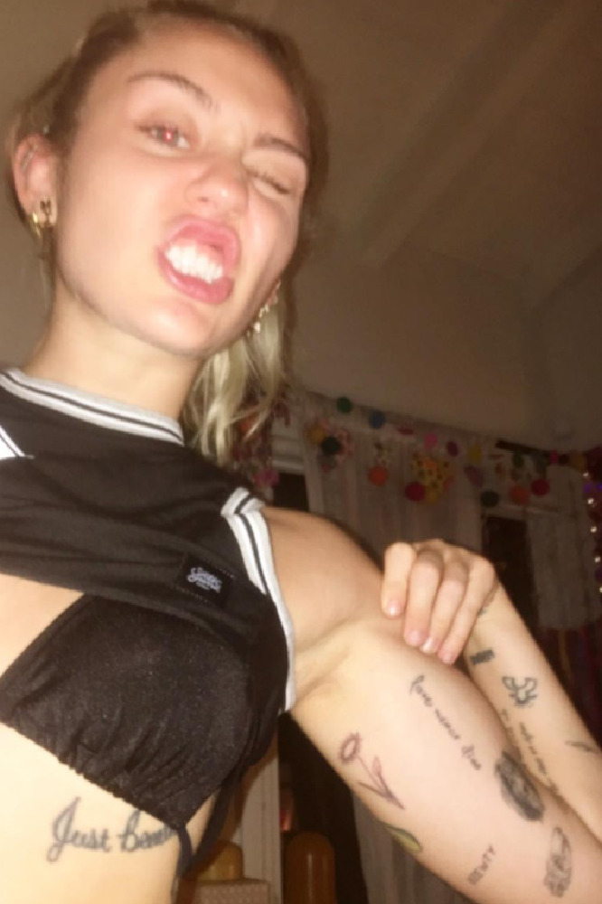 Miley Cyrus Has Vegan Society Symbol Tattooed On Her Arm