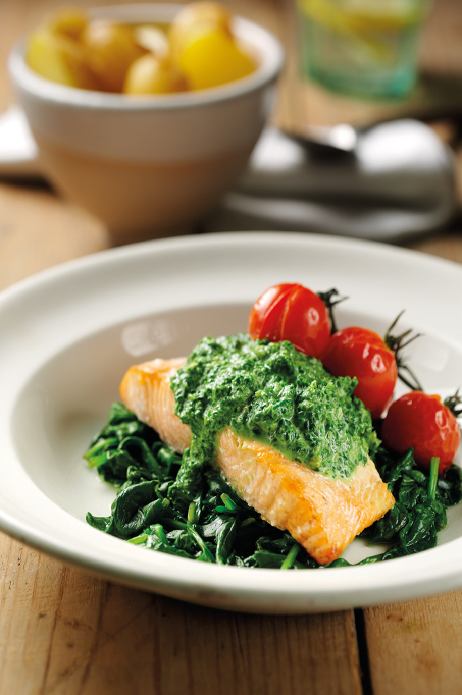Salmon With Creamed Spinach Sauce On Wilted Kale