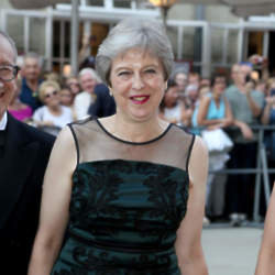 Theresa May in what may be described as happier times / Photo Credit: babirad/FAMOUS