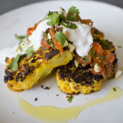 Seared Cauliflower Steak served with Coconut Cream, Blistered Tomatoes and Coriander Salsa