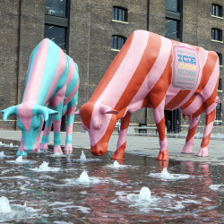Candy-striped ice-cream cows enjoy the goings on at King's Cross ice-cream festival