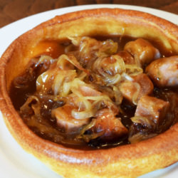 Caramerlised Onion & Cumberland Sausages In A Giant Yorkshire Pud