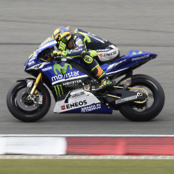 Valentino Rossi Testing The M1 Motorcycle's Engine within the Frame of the Current Motorcycle.